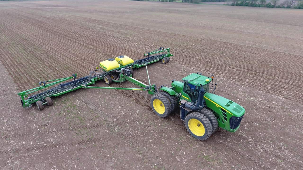 Using a John Deere tractor and plattern to plant corn - Loren King on Unsplash