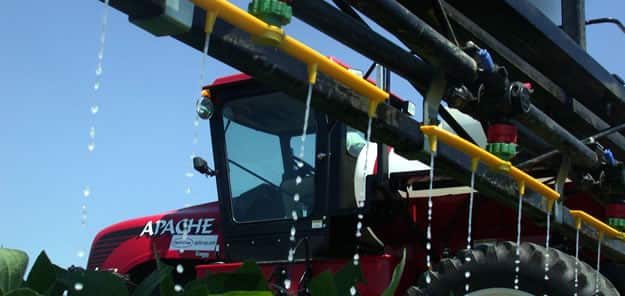 Fertilizer being applied to a crop in a field